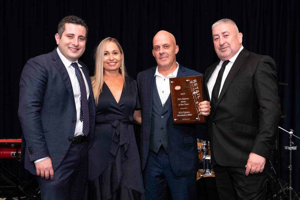 WINNERS: IGA National Retailer Council deputy chair Frank Spano with Jacki and Dan Rigney and Roy Leisk Supermarkets Queensland general manager.

 
