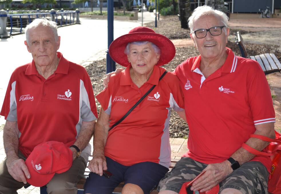 COMMITTED WALKERS: Walkers John Ward, 93, and Walma Scott, 94, with retiring group leader Percy Burden at Raby Bay.