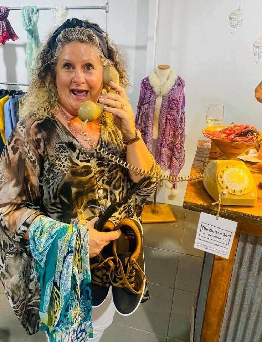 HAPPY CUSTOMER: Linda Minelle picks up some goods at the Button Jar Collective.