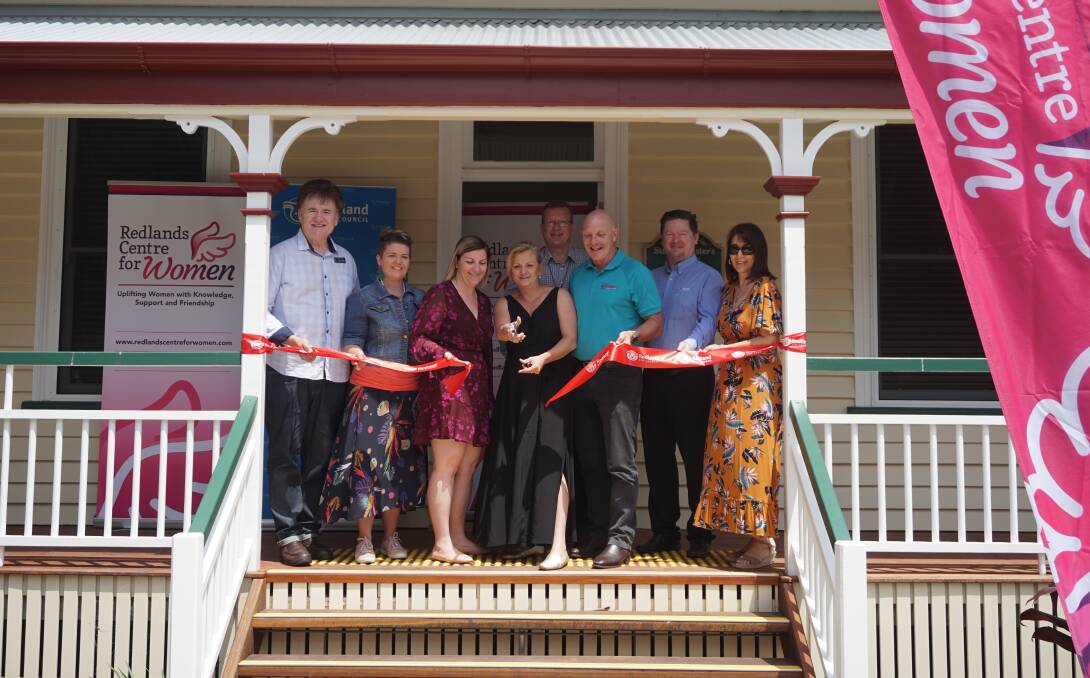 HISTORY: Mayor Karen Williams and RCW manager Sandi Shuttleworth were joined by fellow councillors and supporters to cut the ribbon on the new home for the Redlands Centre for Women.
