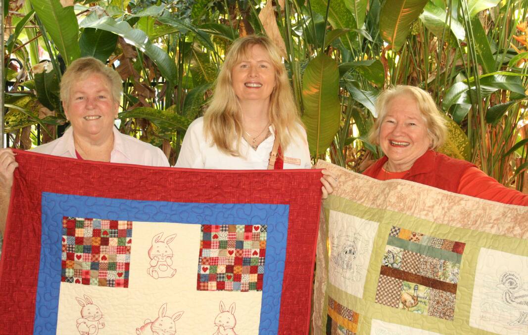 QUILTERS: Denise Dwyer with Redland District Special School principal Cynthia Mangakahia and Elke Maloney.