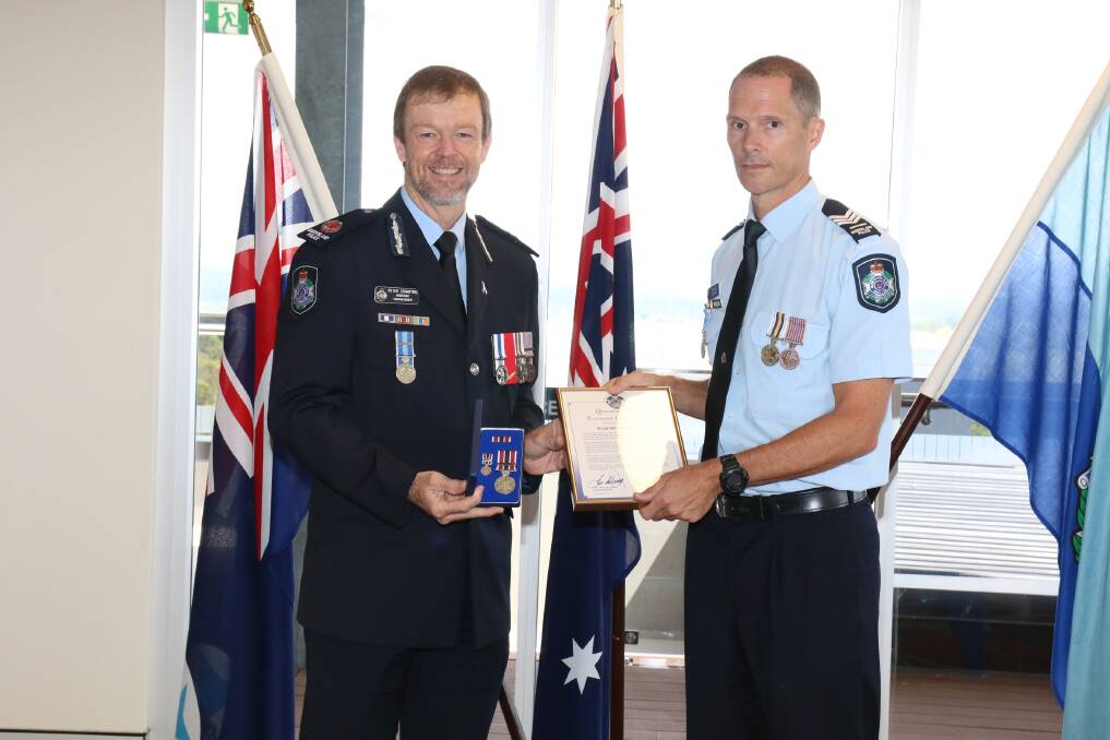 LOCAL HERO: Sergeant Patrick Bates with Assistant Commissioner Peter Crawford.