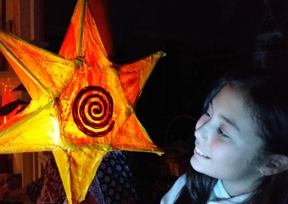 LIGHT UP THE NIGHT: Ava Henderson of Russell Island with a beautiful lantern.
