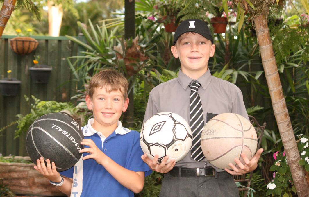 SPORTS FANS: Clancy and Harry Taske are collecting sporting goods for children in remote Western Queensland communities. Photo: Stacey Whitlock