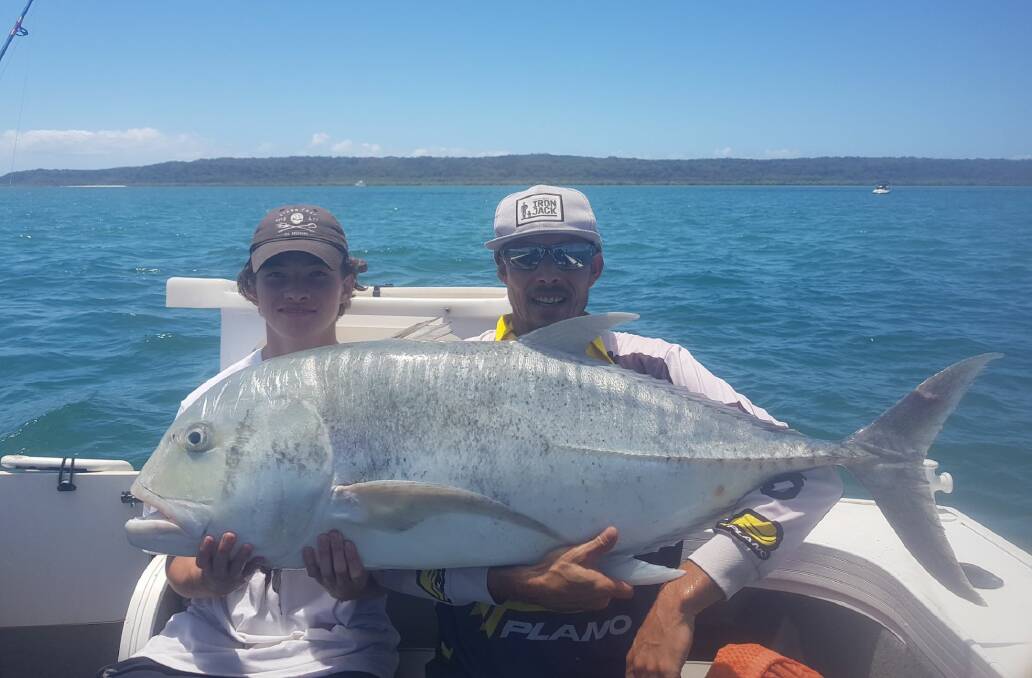 MAJOR CATCH: Jordan Linning and Jeoffery Bryde with one of the giant trevallies caught at the Rainbow Channel.
