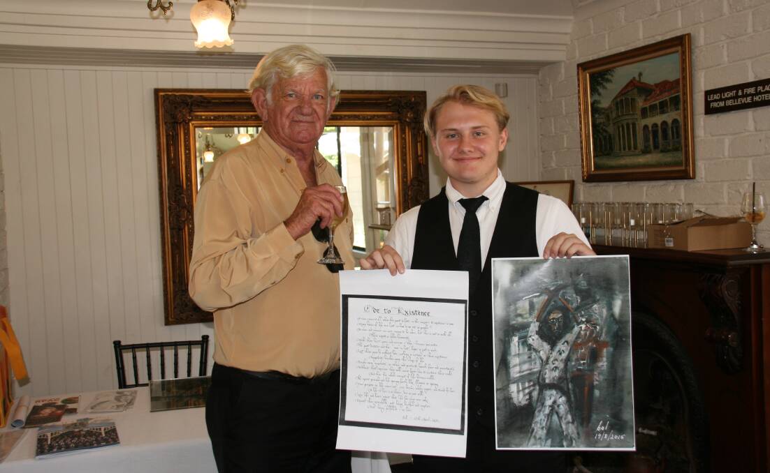 GIFT: Col Owens presents a poem and a copy of a painting to Jack Godfrey from the Courthouse Restaurant.