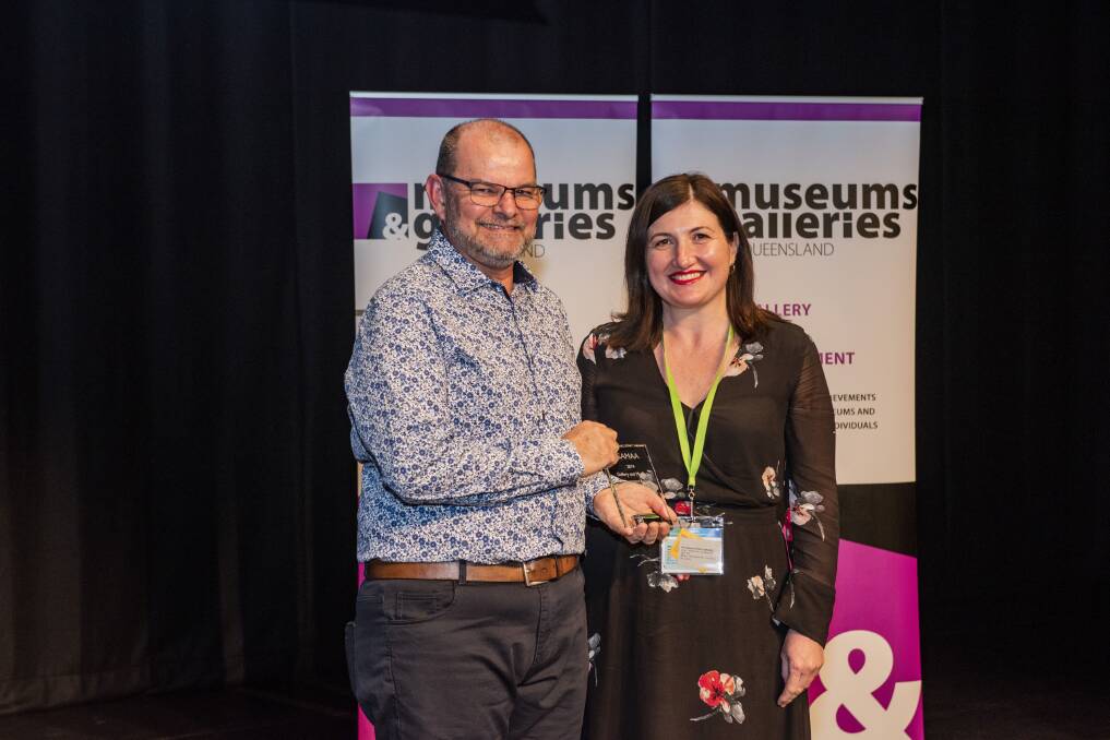 FINALIST: GAMAA judge Robert Ryan from Mackay Regional Council with Emma Bain from Redland Art Gallery. Photo: Blue Click Photography, courtesy of Museums & Galleries Queensland.