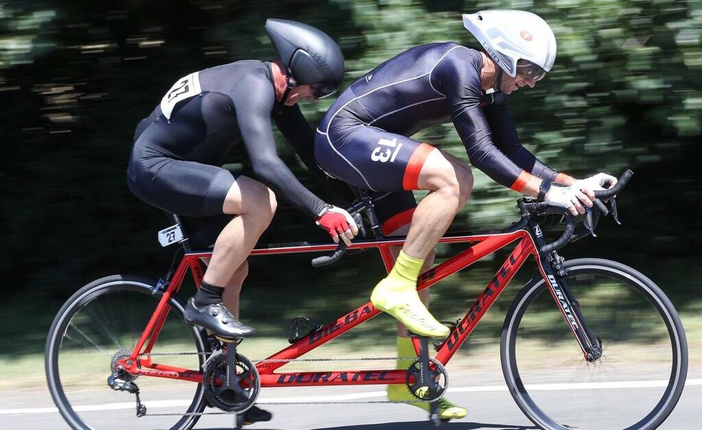 ON THE ROAD: Cameron (back) with pilot Thoms at the road cycling championships. Photo: Con Chronis Photography.
