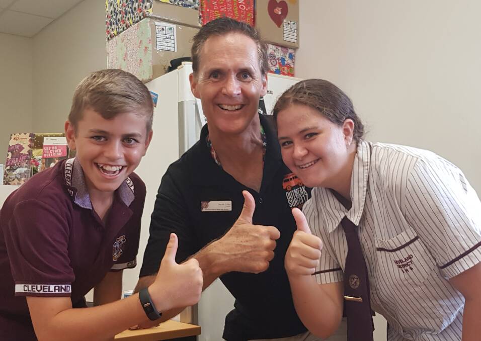HAPPY CHAPPIES: Neale Collier with students in the school's drop-in centre, which is run by the chaplains.