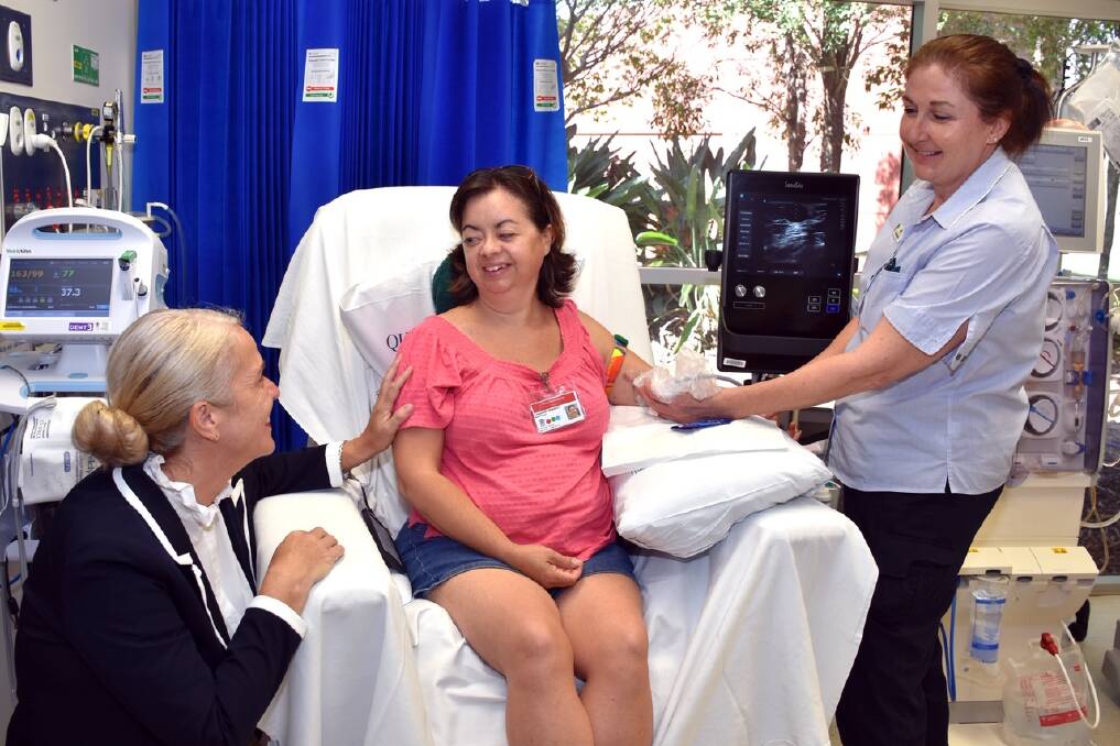 NEW MACHINE: Redlands MP Kim Richards with patient Cassie Briebach and clinical nurse consultant Ali Humpleby.