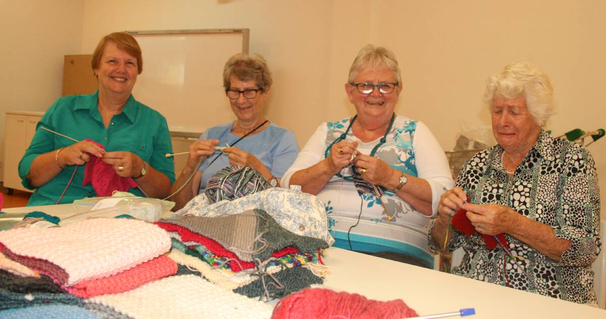 GENEROUS: Janice Dorver, Chris Baker, Lynda Langham and Althea Burrows with some of theitems knitted by Victoria Point volunteers.