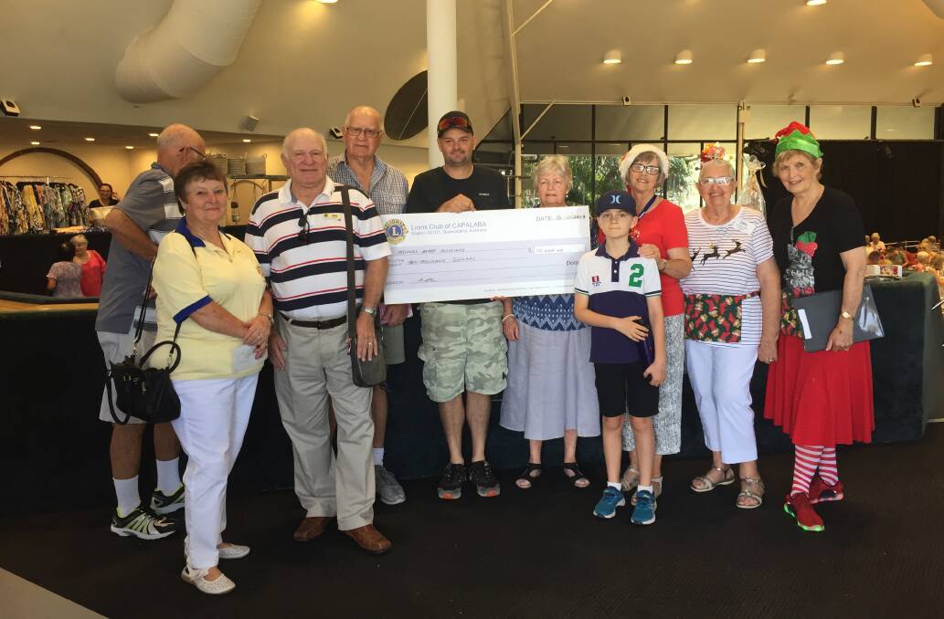 GENEROUS: Members of the Capalaba Lions and the Mater Private Hospital Redland Auxiliary with Glenn and Isaac Constable. 