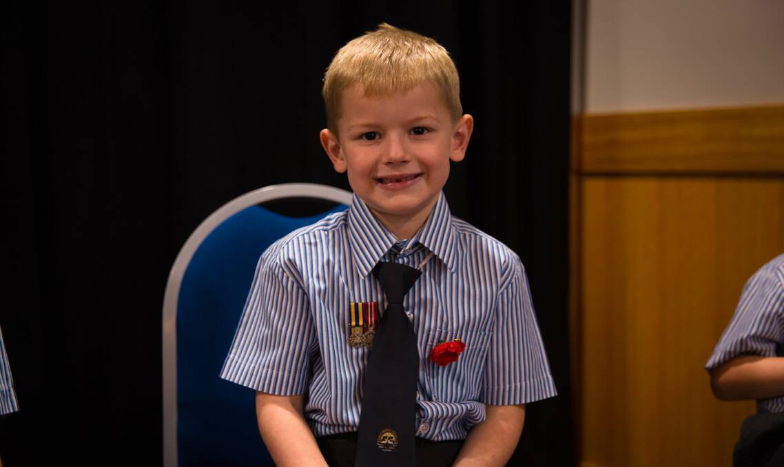 PROUD: Sheldon College prep student Nate Wilson wore his grandfather's medals to the school Anzac ceremony.