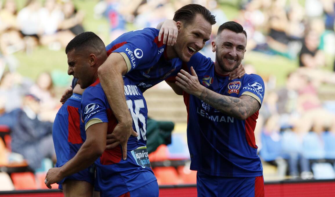 DROUGHT BREAKER: Skipper Nigel Boogaard celebrates after scoring his first goal in 15 months to help steer the Jets to a 2-0 win over Melbourne Victory at McDonald Jones Stadium on Saturday. Picture: Darren Pateman (AAP)