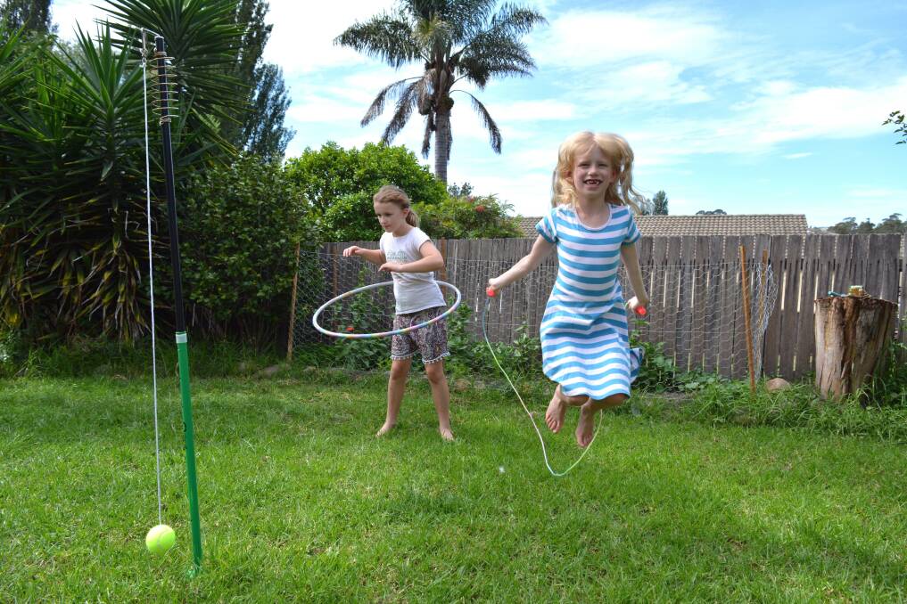 Jasmine, 9, and Abigail, 7, enjoy the great outdoors and some exercise with a hula hoop and skipping rope. A little pop tennis is also on the cards.