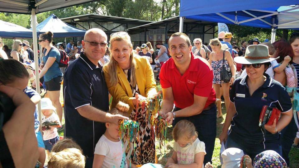 PLAYGROUP: MP Don Brown and Mayor Karen Williams get into the Redlands National Playgroup event at Capalaba Park.