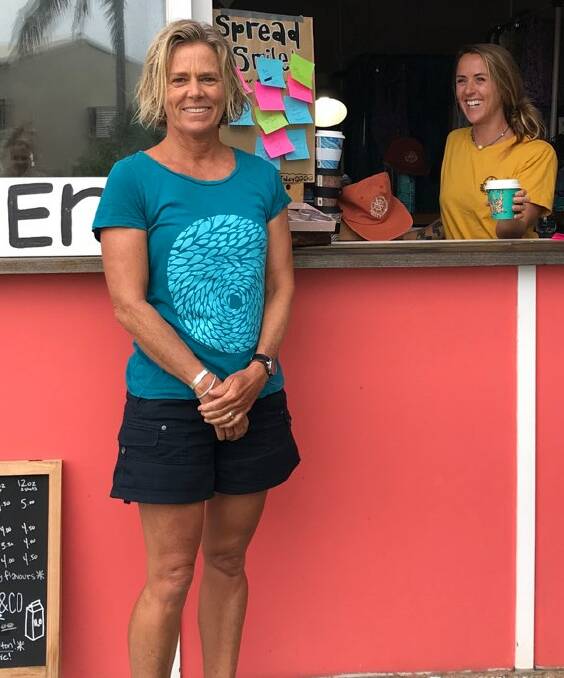 SMILES: Sue Jenner, the owner of Island Juice van, gets a coffee from Jess Scott of Starfish Studios, a Point Lookout homewares designer. Sue's shirt is a Starfish design.