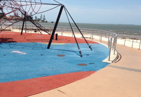 POLLUTION IN PROGRESS: The playground at Manly, with plastic flooring breaking up.