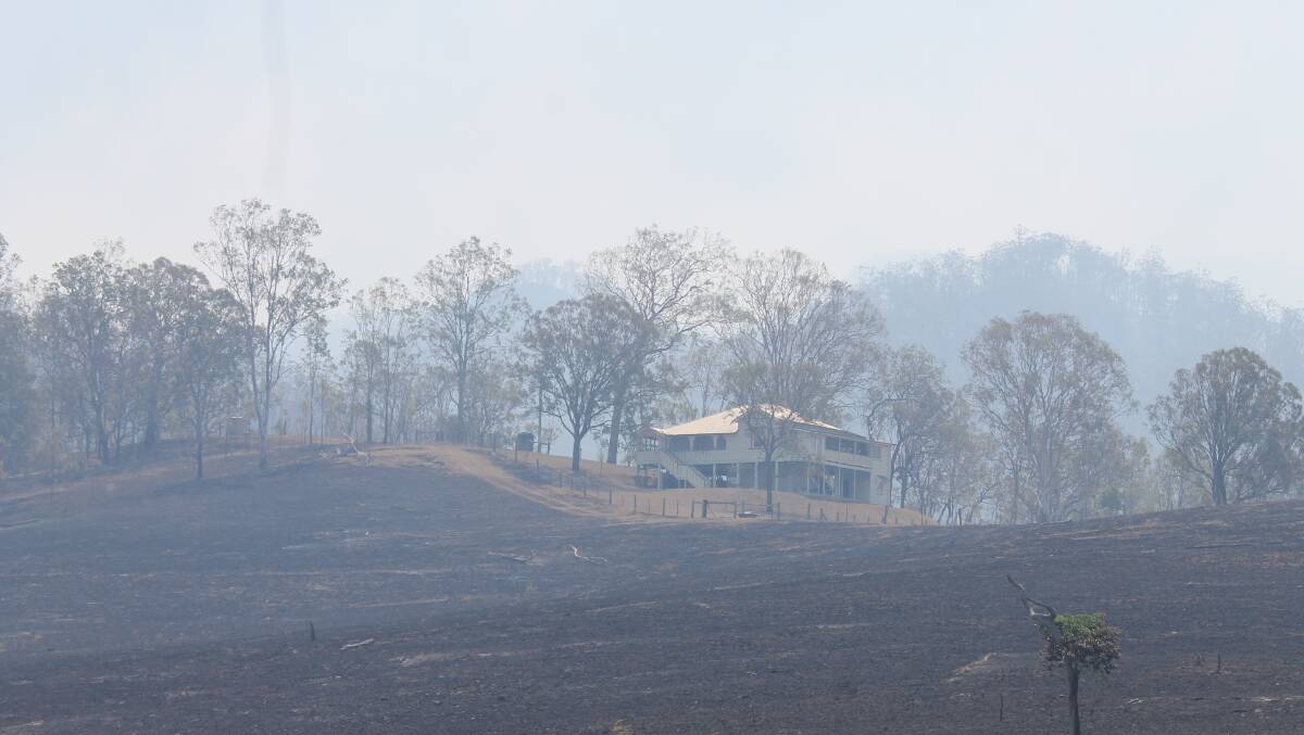 NEAR THING: FIRES: A farm house saved from fire at the Scenic Rim last month. Some bushfires are still burning.