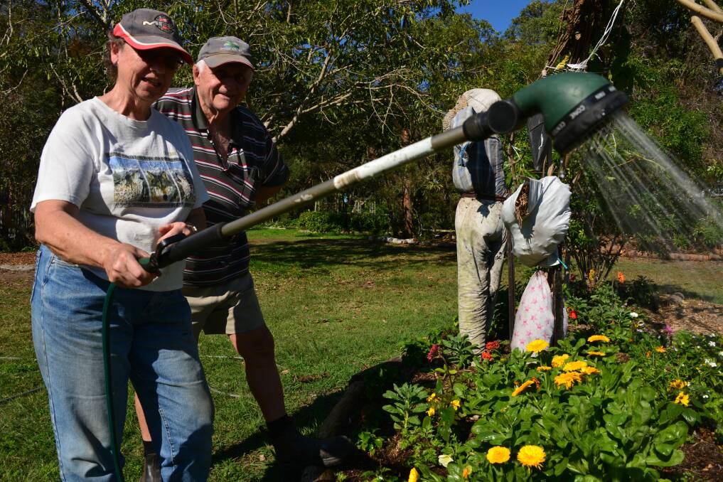 KEEN GARDENERS: Glenda Brown of Birkdale and Tony Chapman of Capalaba give the lush gardens some tender care. 