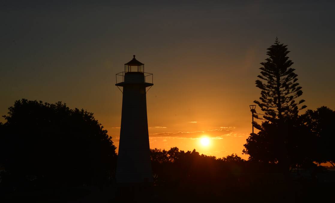 REDLANDS: For some people, it is the natural beauty of the region. Here the sun sets behind the Cleveland Lighthouse.