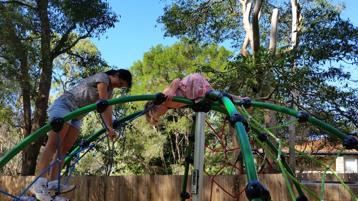TEA-CUP COTTAGE: Kids get wild on the climbing frame.