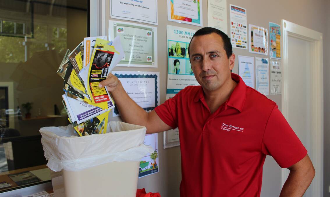 SCRAP BREWS: Capalaba MP Don Brown with election flyers.