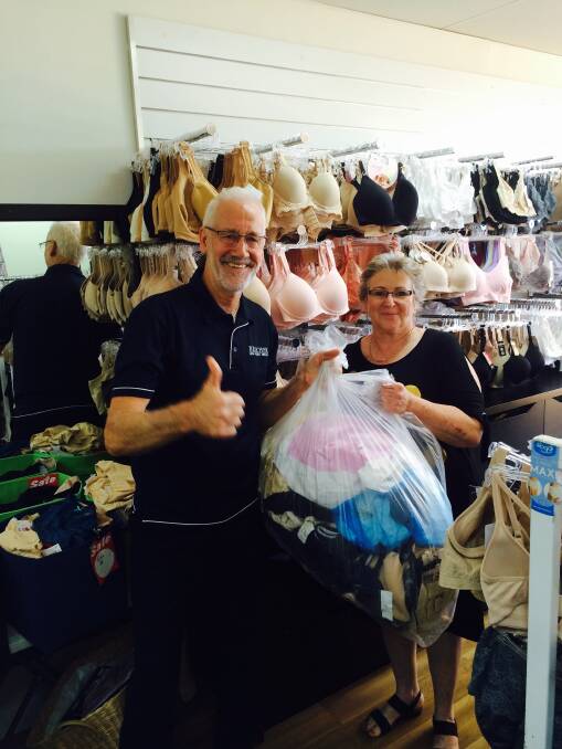 GENEROUS SOULS: Rotary's Gordon Lawrence and Therese Thorp and  a bag of bras ready to go.