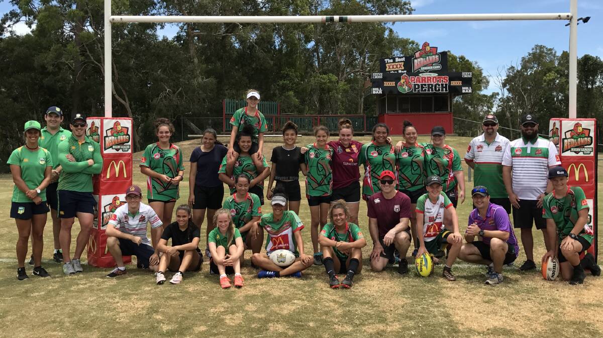 LEAGUE DAY OUT: Adrian Vowles in the red hat in the front row with players and coaches at the Redlands Rugby League Club event.