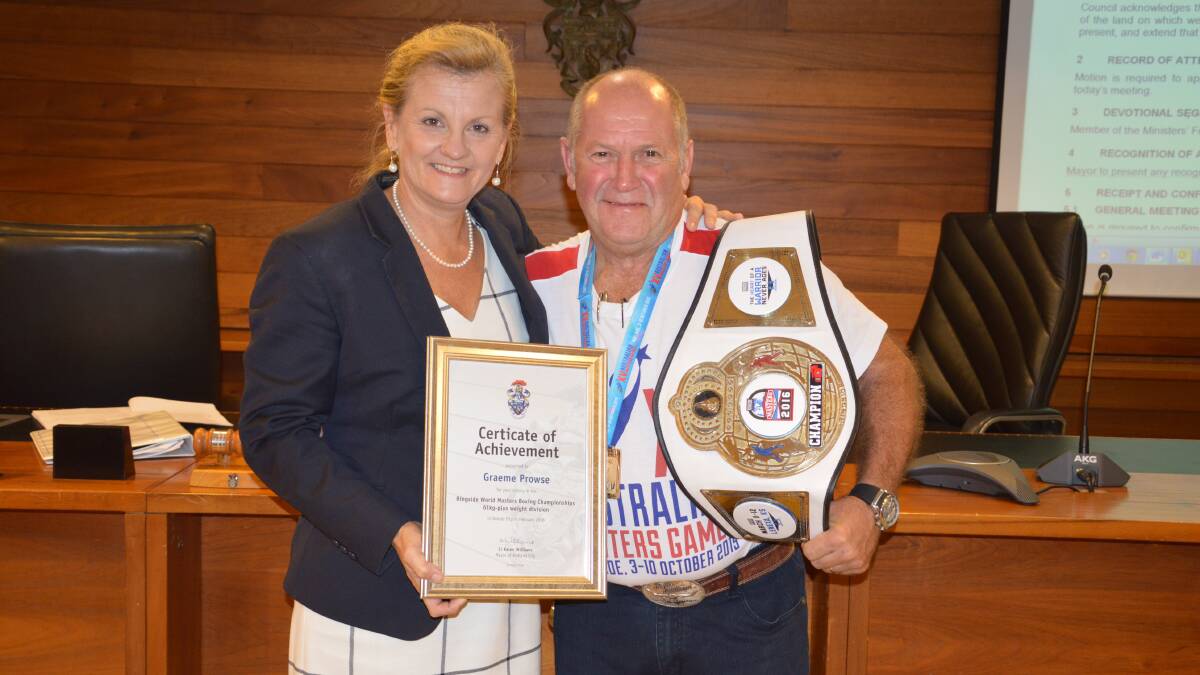 boxing champion: Redlands boxer Graeme Prowse who has won a world masters boxing championship. He is with Mayor Karen Williams.