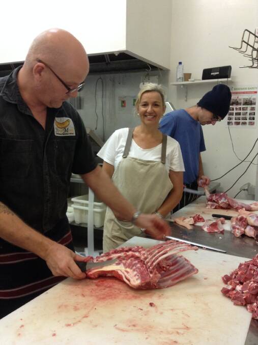 MEATY SUBJECT: Amanda Scibilia gets the low down on a few chops from butchers Flemming Jakobsen on left and Tom Thorn.
