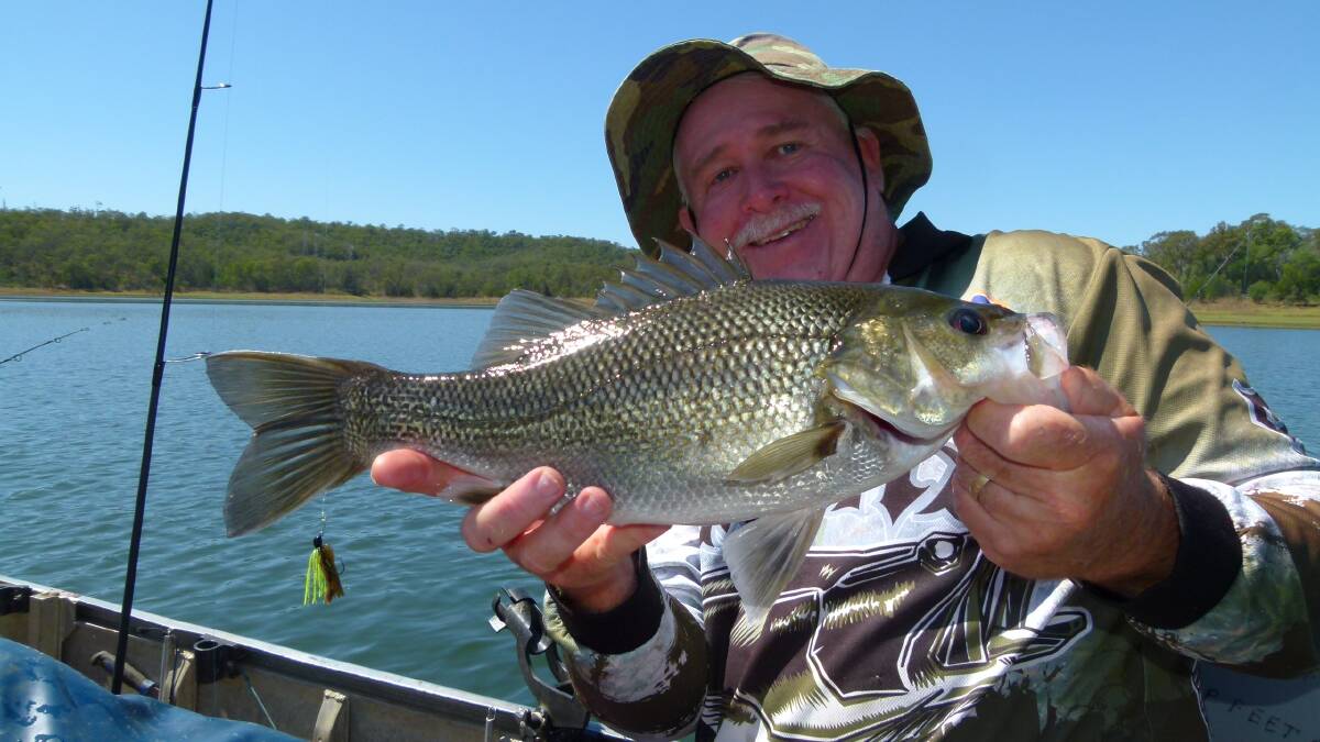 SWEET FISH: Neil Stratford with a healthy bass from North Pine Dam.