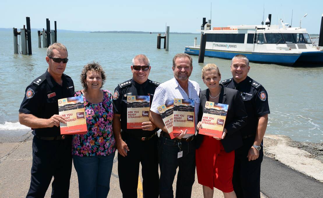 AWARD WINNING: QFES NSI station officer Bill Ewing, Council officer Allison Lamb, QFES area commander Paul Whalley, Council’s manager disaster planning and operation Mike Lollback, Mayor Karen Williams and QFES acting superintendent with emergency information packs heading to Straddie.