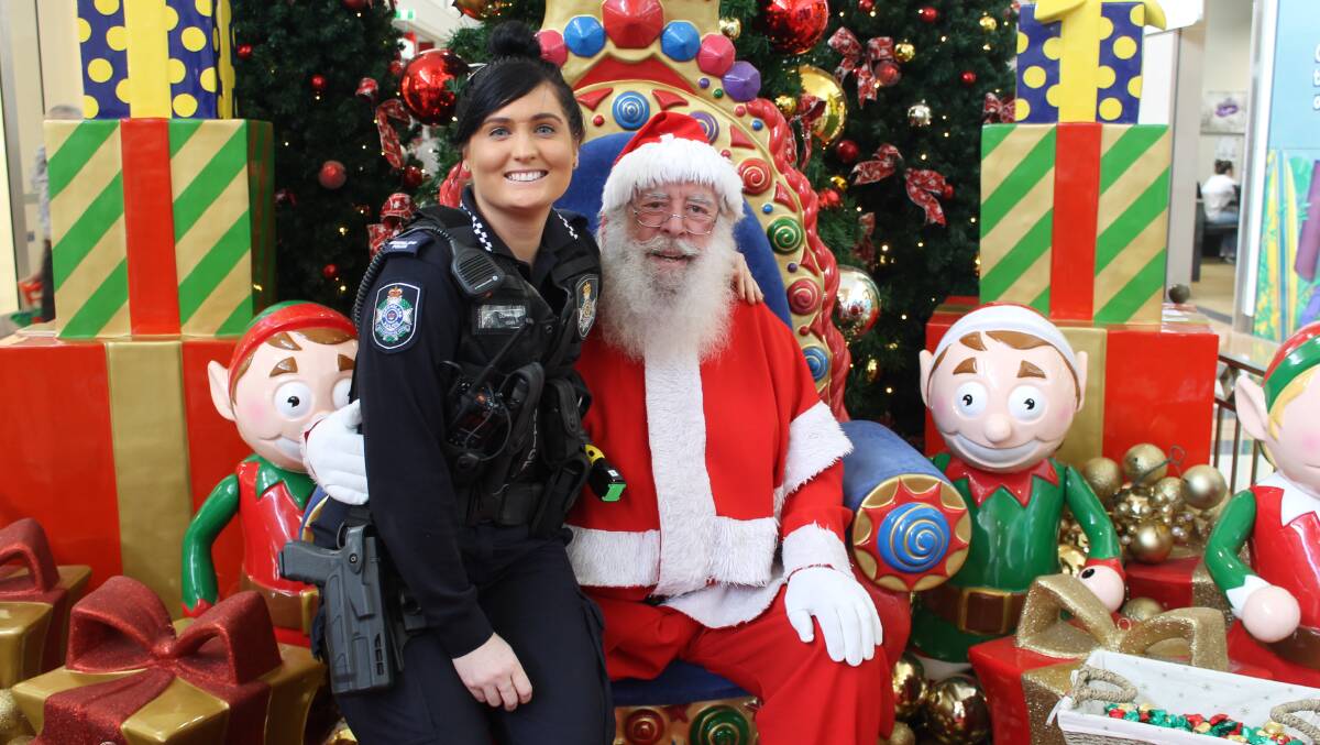 LAWFUL CHRISTMAS: Constance Steph Randolph from Cleveland police station with Geoff Bowden, also known as Santa Claus.