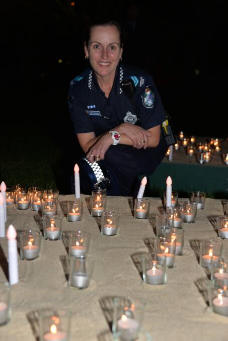 police presence: Snr Constable Kerri-Ann Stevens of the domestic violence unit at a Cleveland ceremony to remember victims.