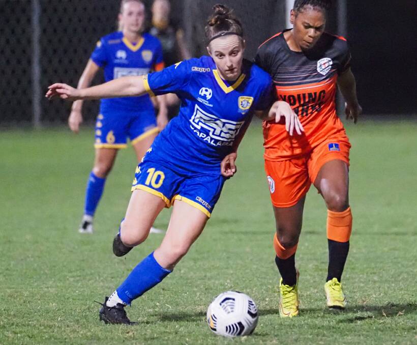 POSSESSION: Goal scorer Issy Ward from Capalaba in a good battle for possession with a hard running Grange player. Photo: Alan Minifie/Capalaba FC
