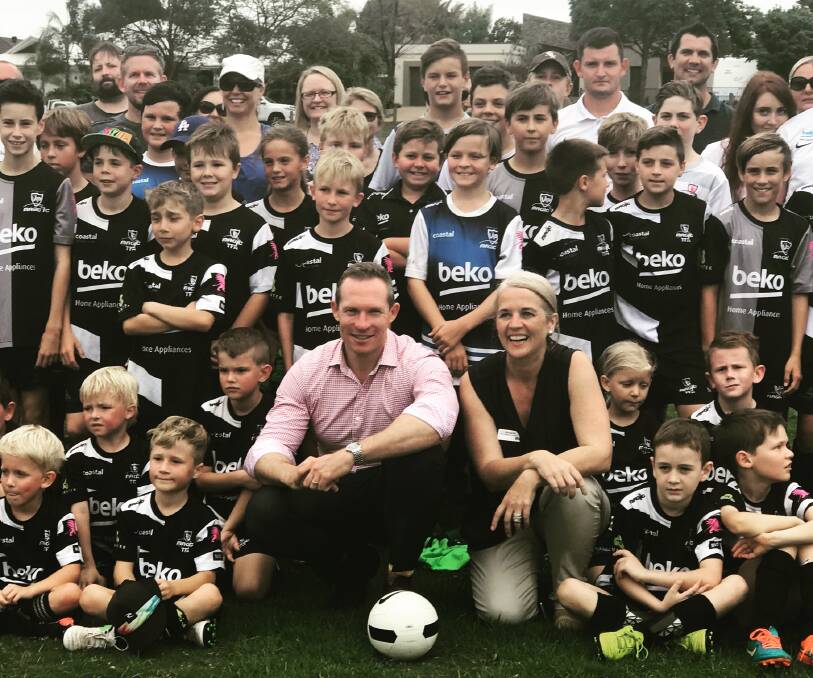 MAGIC MOB: Sport Minister Mick de Brenni and Redlands labor candidate Kim Richards with some magic soccer players at Victoria Point.