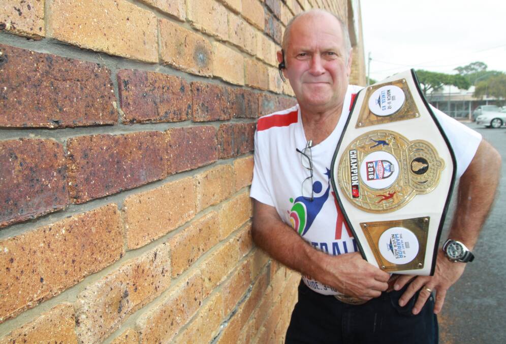 hard hitter: Boxer Graeme Prowse with the masters world championship belt he won fighting in the 75kg division in the US.