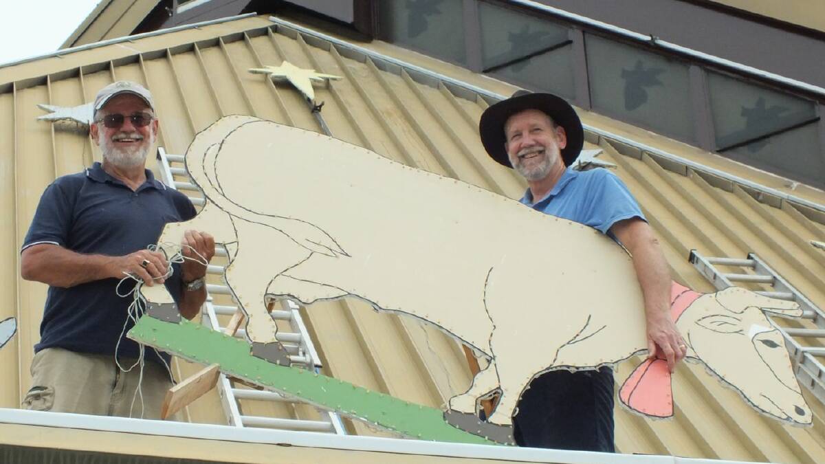 DISPLAY: Don Ruwoldt and Ernie Day put up the display on the roof of the church.