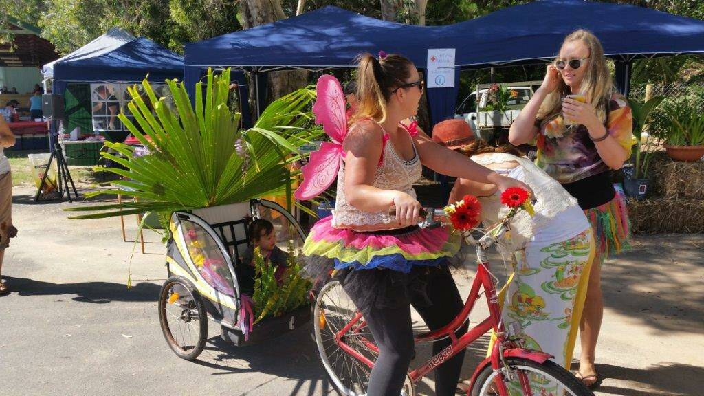 KARRAGARRA FESTIVAL: Snazzy outfits and bikes sprouting plants are part of the fun at the island knees-up. 