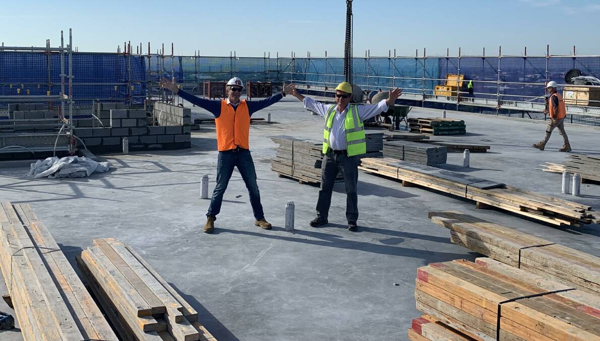PROJECT UNDER WAY: Developers Dario Pigozzo and Peter Endacott on the apartment block roof.