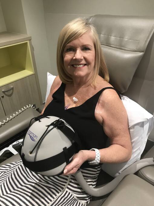 COOL TIMES: Redlands local Ellen Buckingham with the scalp cooler she has used in an effort to prevent hair loss during chemotherapy.