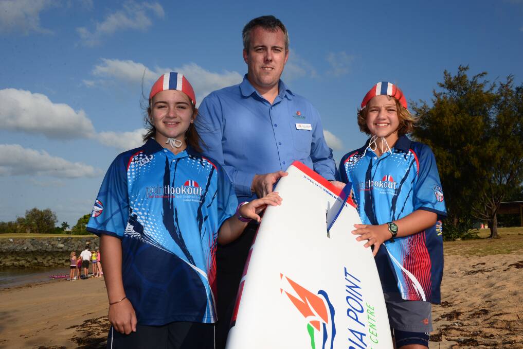 GOLD MEDAL BOARDS: Victoria Point Shopping Centre marketing manager Evan Jamieson with nipper vice-captain Erin Oxenham, 13, of Gumdale, and nipper captain Joel Pryor, 14, of Wellington Point. 