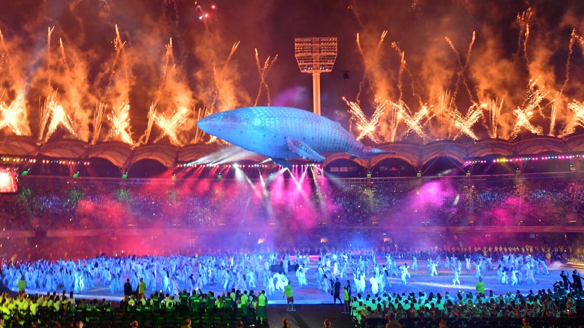 BEAUTIFUL SIGHT: Migaloo ghosts out over performers at the end of the Commonwealth Games opening ceremony.