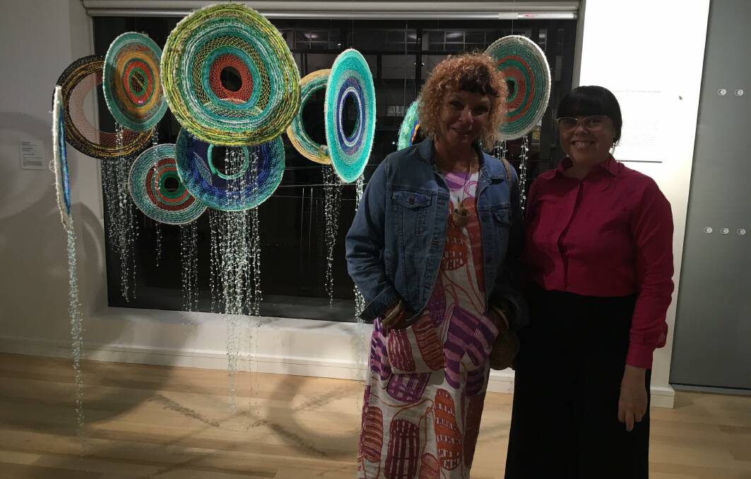ART ON SHOW: Sonja Carmichael with Kellie Williams in front of her work in the Eddie Mabo exhibition at Redland Gallery.