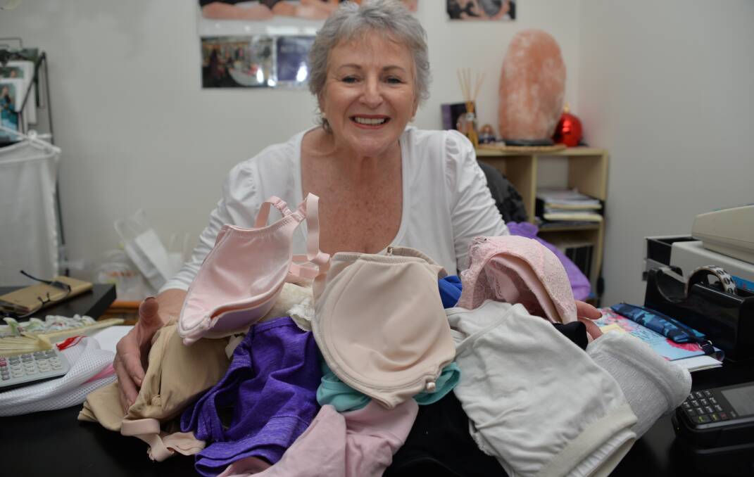 GIVING PEOPLE: Therese Thorp with mountains of bras which are heading for Vanuatu.