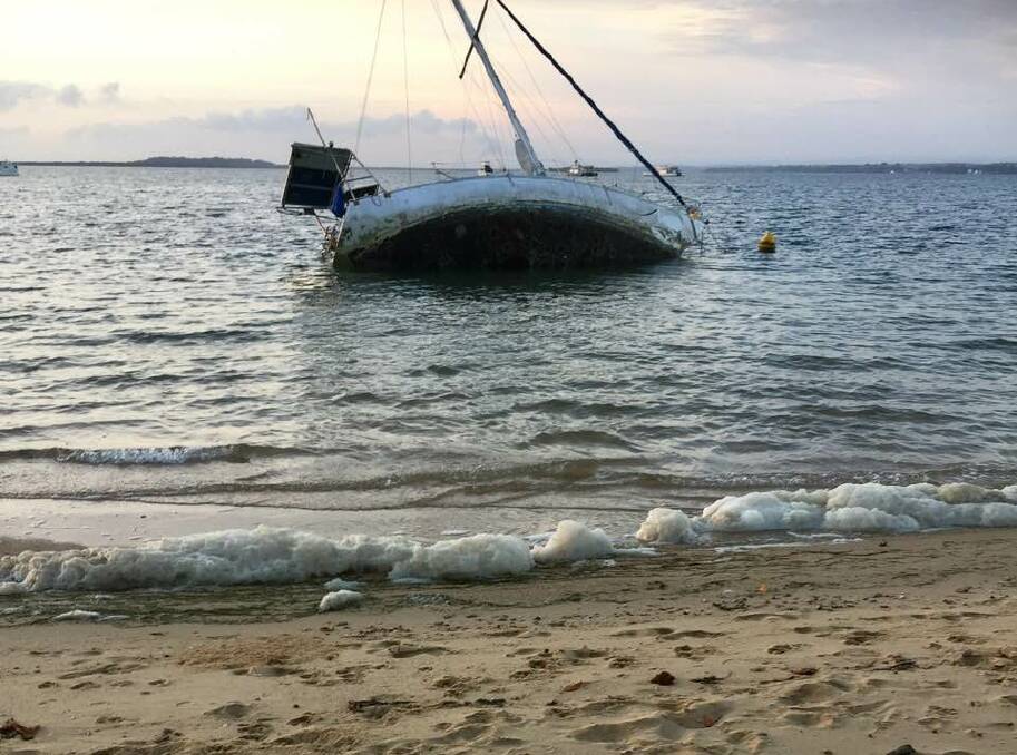 COOCHIEMUDLO: The yacht aground off Coochiemudlo Island's main swimming beach.