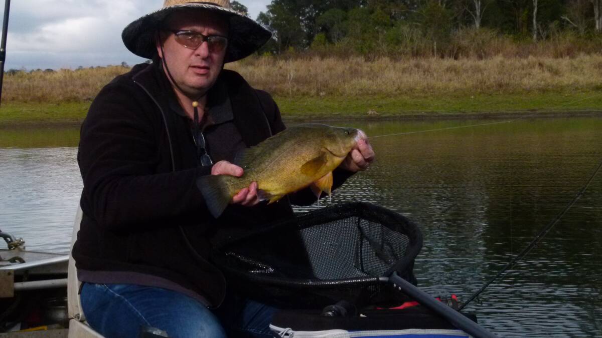 LAKE FISHING: Guy Primrow with a fat golden perch.