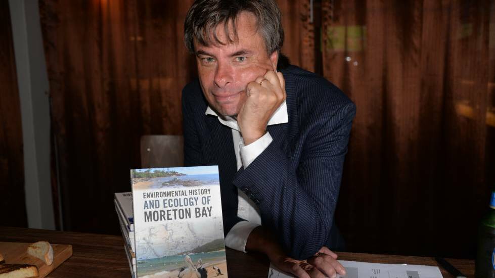 SCIENTIST: Dr Daryl McPhee with his book published by the CSIRO about Moreton Bay.