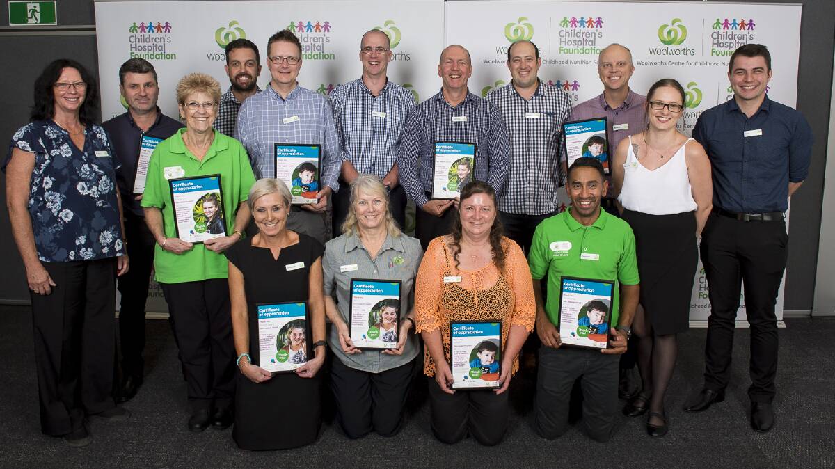 CELEBRATION: Woolworths staff celebrate helping out a few kids.